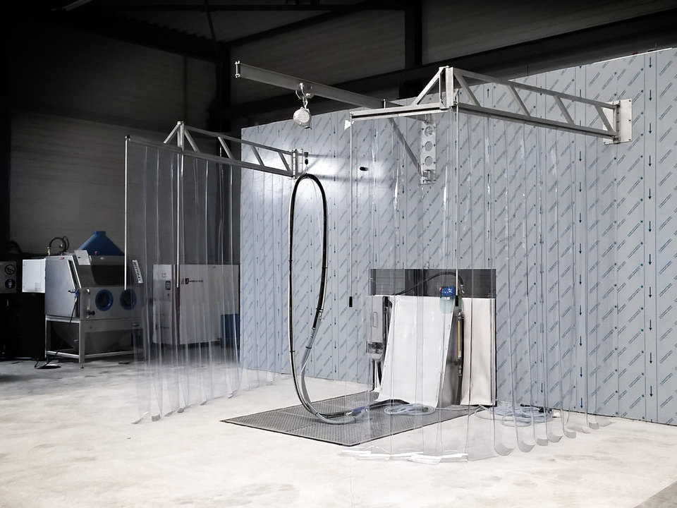 SublimotionProcess® treatment platform with strip curtains, and a process cabinet on the left